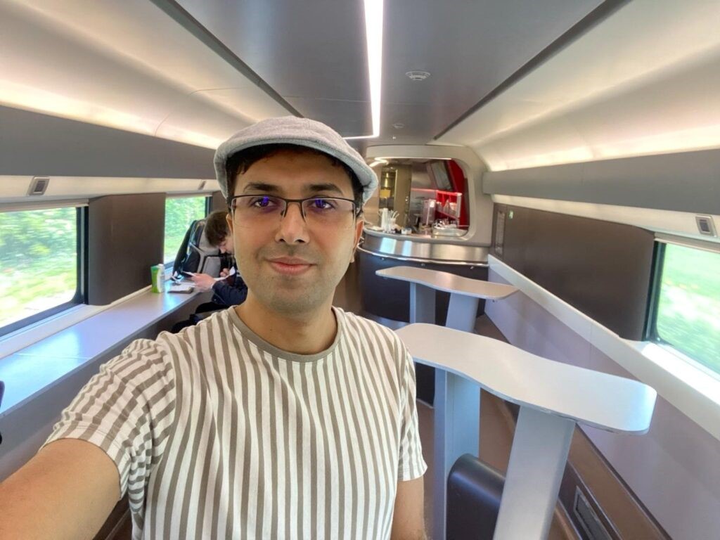 A high-speed train pulling into a station in Italy